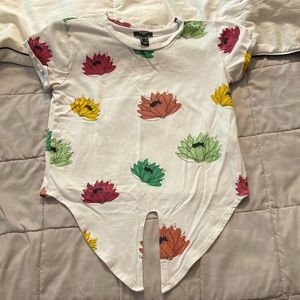 White t-shirt with flowers.